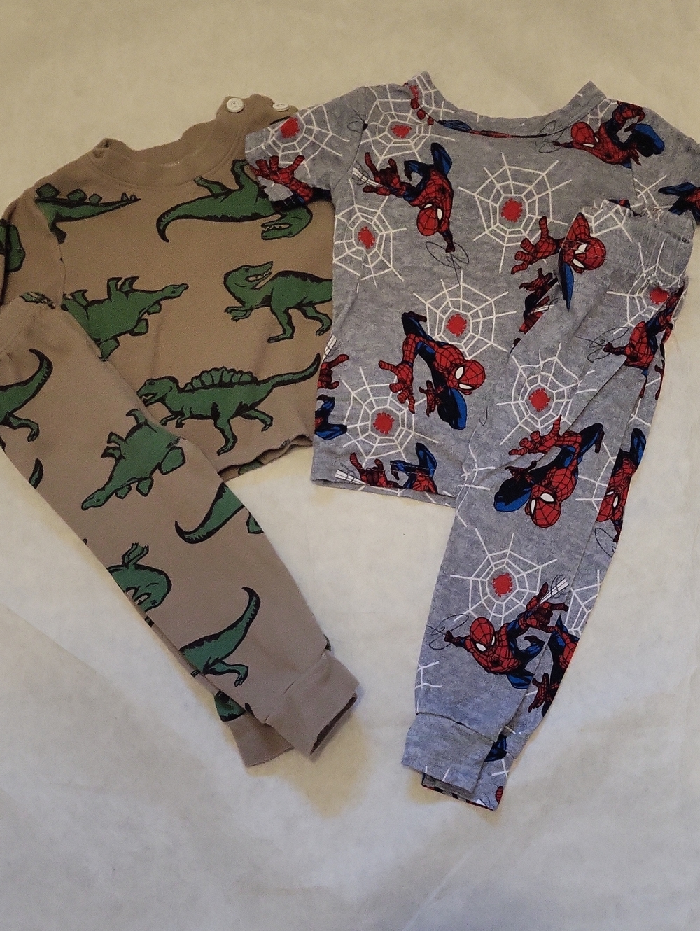 Two toddler pajama sets